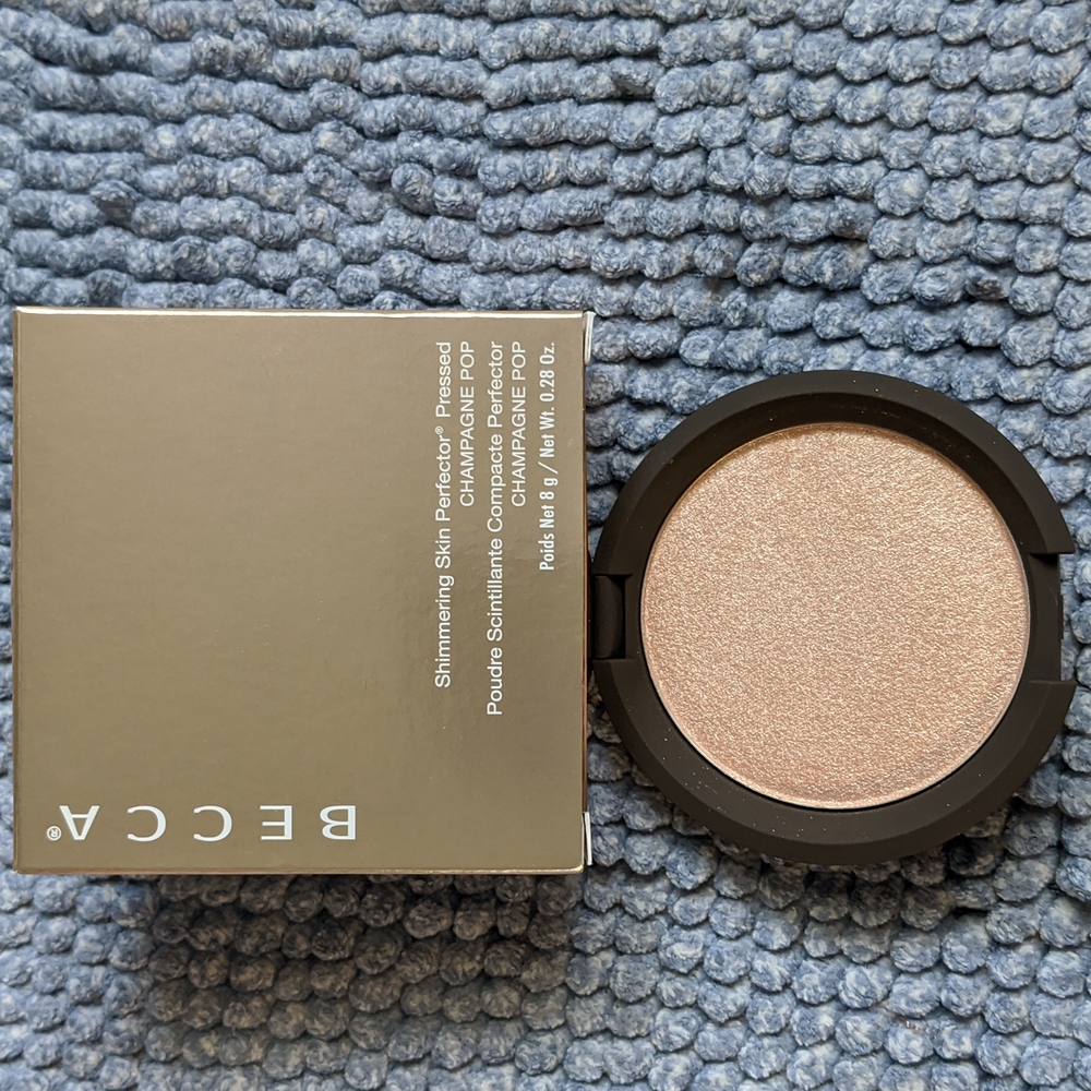 Becca cosmetics highlighter in Champagne pop